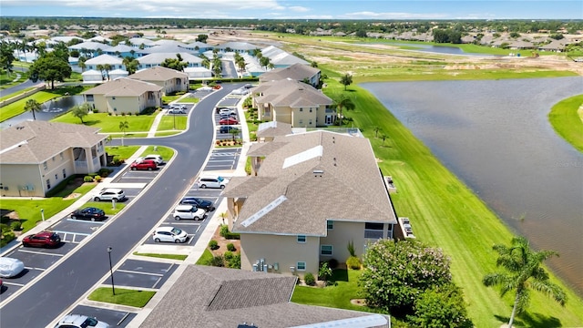 bird's eye view featuring a residential view and a water view