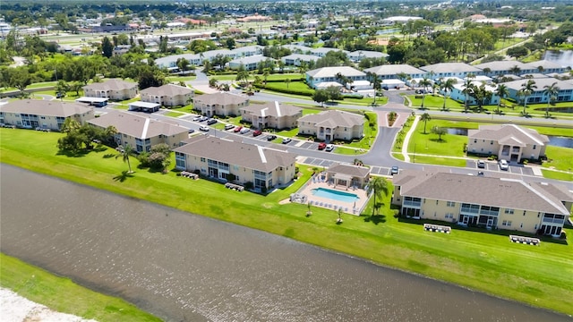 bird's eye view featuring a residential view and a water view