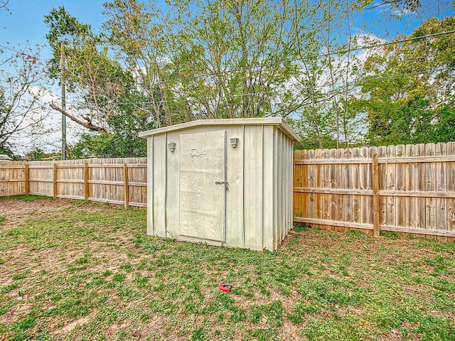 view of shed featuring a fenced backyard