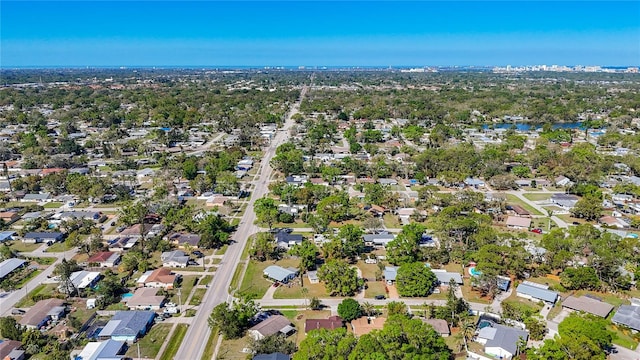 bird's eye view with a residential view and a water view