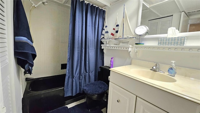 bathroom with vanity, toilet, and shower / bathtub combination with curtain