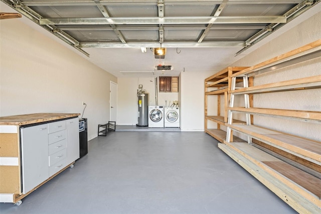 garage with independent washer and dryer and electric water heater