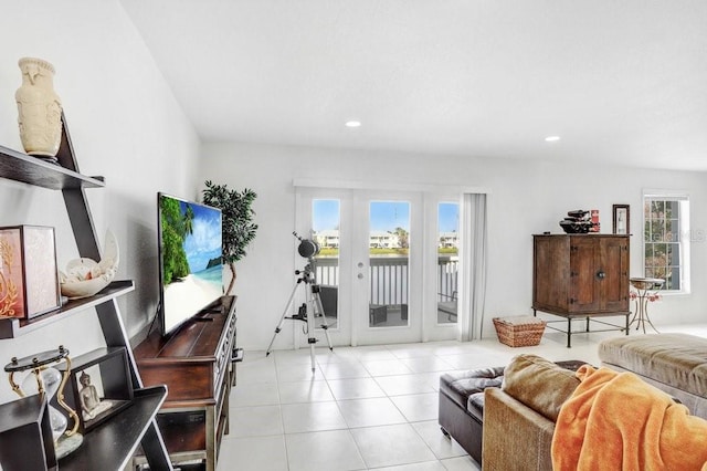 living room with light tile patterned floors, recessed lighting, and french doors