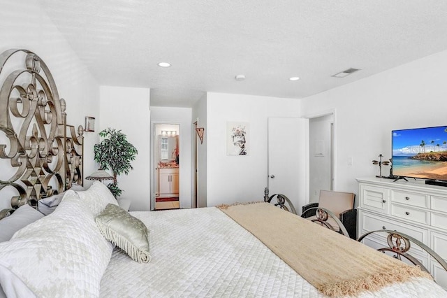 bedroom featuring recessed lighting and visible vents