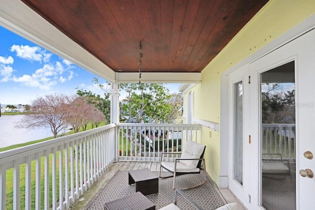 balcony featuring a water view