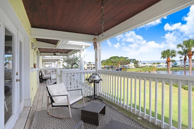 balcony featuring a water view