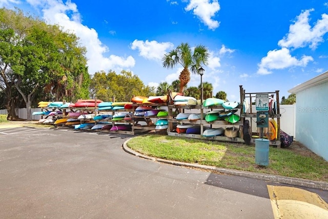 view of property's community featuring playground community and fence