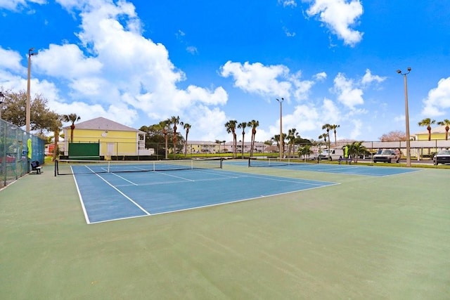 view of tennis court with fence