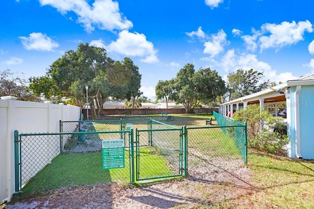 view of yard with a gate and fence