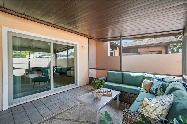 sunroom featuring plenty of natural light and wooden ceiling