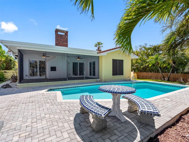 view of pool featuring a patio area, a fenced in pool, a ceiling fan, and fence