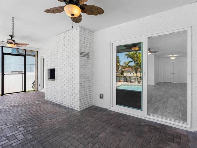 view of patio / terrace featuring ceiling fan