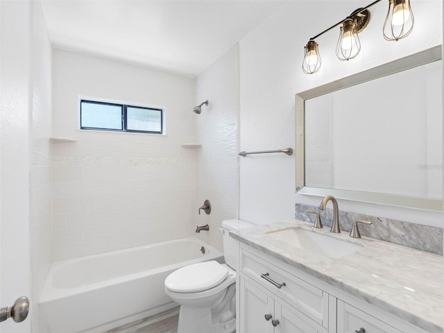 bathroom with vanity, wood finished floors, toilet, and washtub / shower combination