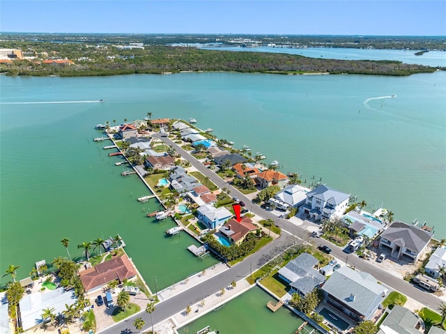 drone / aerial view featuring a residential view and a water view