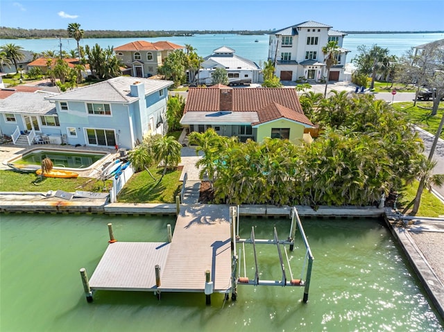 aerial view featuring a water view and a residential view