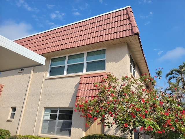 10039 62nd Ave N Unit 14, Saint Petersburg, FL 33708 - exterior space with stucco siding and a tile roof