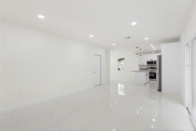 unfurnished living room with marble finish floor, baseboards, visible vents, and recessed lighting