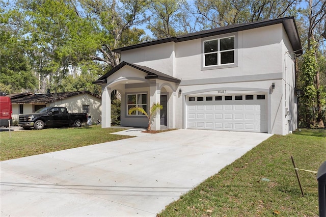 traditional home with stucco siding, driveway, a garage, and a front yard