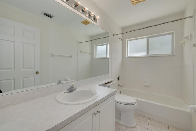 full bathroom featuring vanity, toilet, visible vents, tile patterned flooring, and  shower combination