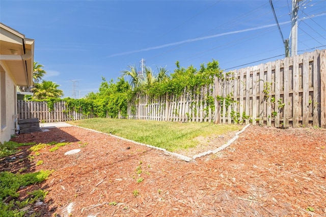 view of yard with a fenced backyard