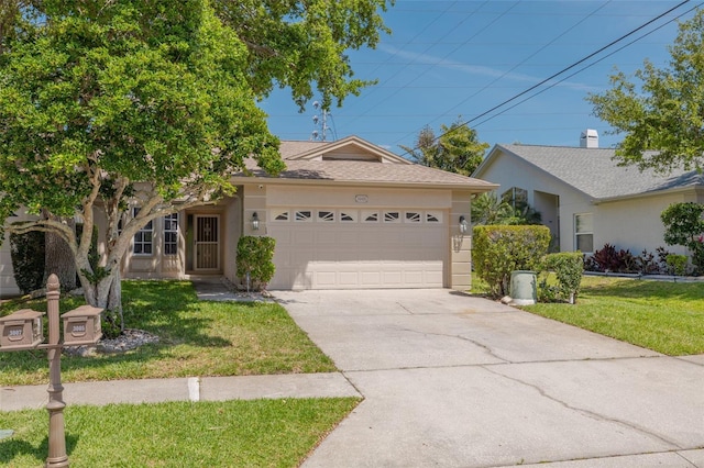 ranch-style house featuring stucco siding, concrete driveway, a front yard, and a garage