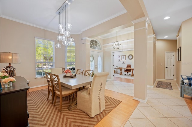 dining area with light tile patterned floors, baseboards, ornamental molding, and recessed lighting