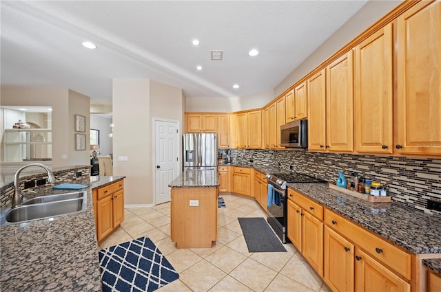 kitchen featuring a sink, a kitchen island, backsplash, stainless steel appliances, and light tile patterned floors