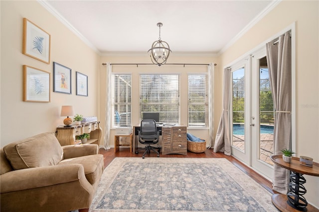 office with baseboards, wood finished floors, an inviting chandelier, and ornamental molding