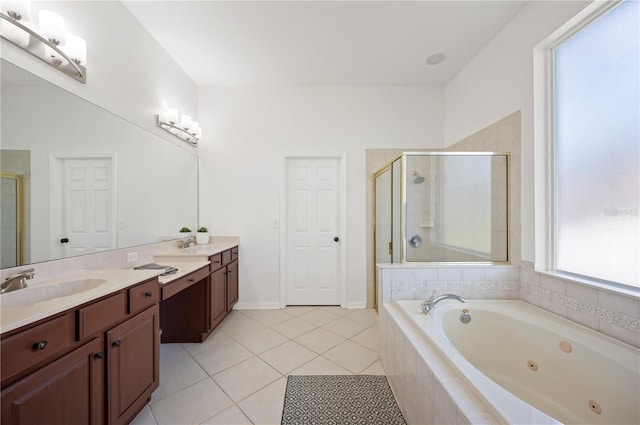 bathroom with tile patterned flooring, a shower stall, a jetted tub, double vanity, and a sink