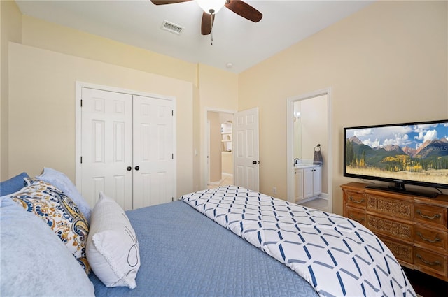 bedroom featuring visible vents, ensuite bathroom, a closet, a ceiling fan, and a sink