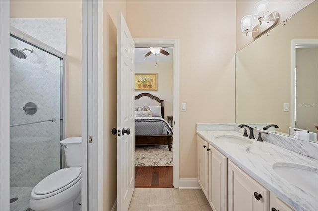 ensuite bathroom with tile patterned flooring, ceiling fan, a stall shower, ensuite bath, and a sink