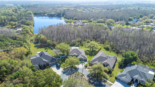 aerial view with a residential view, a water view, and a wooded view