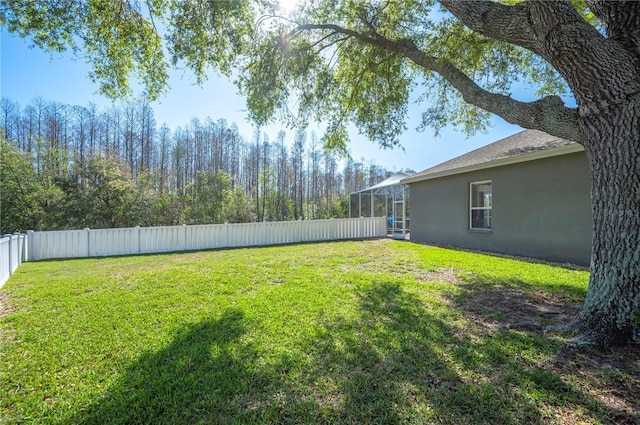 view of yard with a fenced backyard