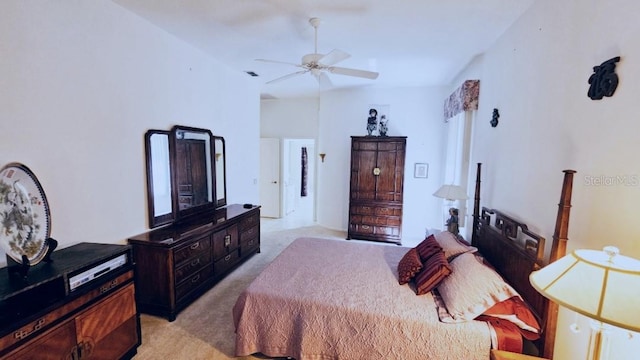 bedroom featuring light carpet