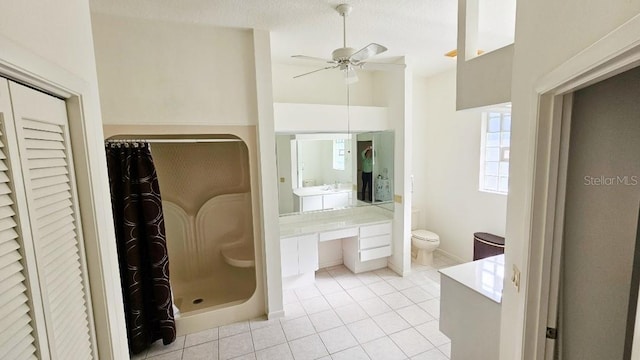 full bath featuring tile patterned floors, toilet, curtained shower, ceiling fan, and vanity