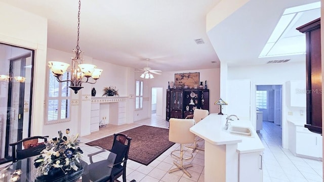 kitchen with visible vents, plenty of natural light, and a sink