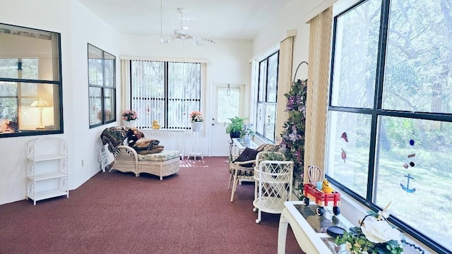 sunroom featuring a notable chandelier and a healthy amount of sunlight