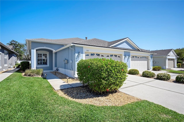 single story home with a front yard, roof with shingles, stucco siding, driveway, and an attached garage