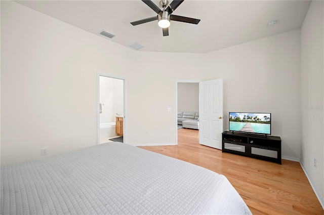 bedroom featuring ceiling fan, visible vents, light wood-type flooring, and baseboards