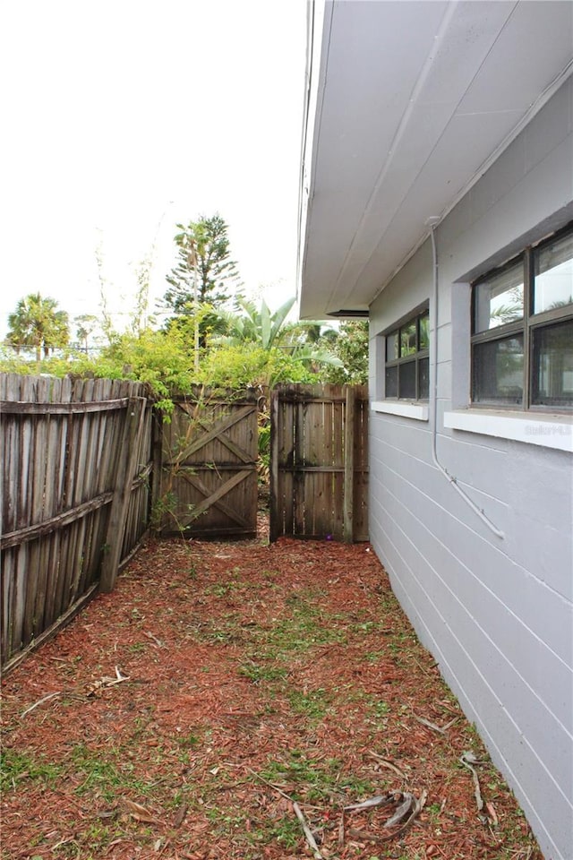 view of yard with a gate and fence