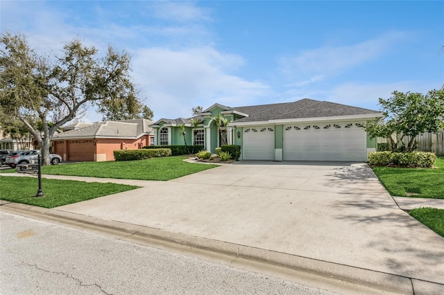 view of front facade with stucco siding, driveway, a garage, and a front yard