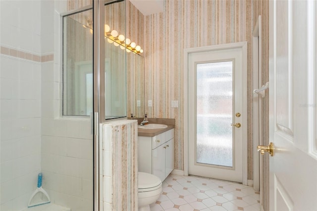 full bath with vanity, wallpapered walls, a stall shower, tile patterned floors, and toilet