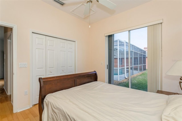 bedroom featuring a ceiling fan, visible vents, access to exterior, a closet, and light wood-type flooring