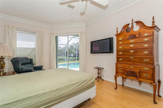 bedroom featuring baseboards, ornamental molding, light wood-style flooring, a ceiling fan, and access to outside