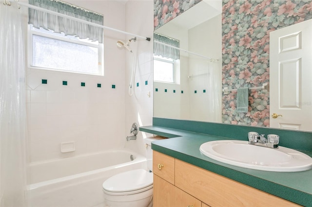 bathroom with vanity, shower / tub combo, toilet, and wallpapered walls