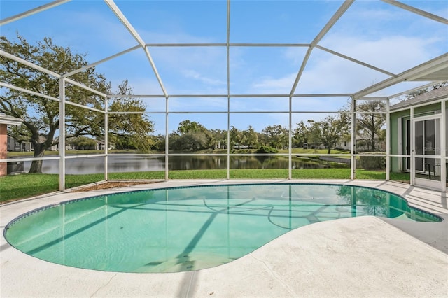 outdoor pool featuring a lanai, a water view, and a patio