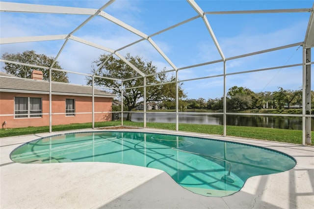 pool with a lanai and a water view