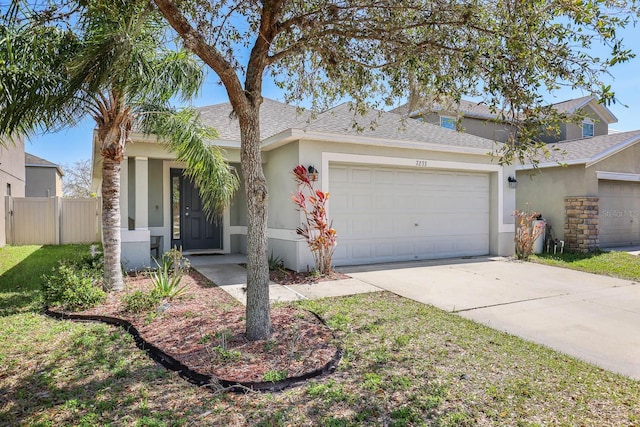 single story home featuring stucco siding, driveway, fence, roof with shingles, and a garage