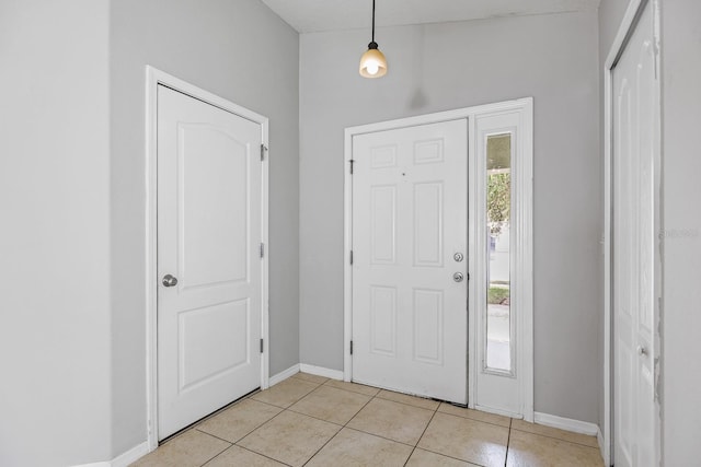 7233 Lumber Port Dr, Ruskin, FL 33573 - foyer with baseboards and light tile patterned floors