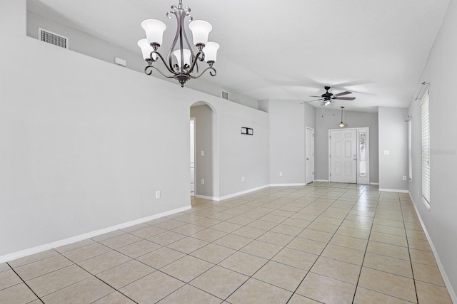 7233 Lumber Port Dr, Ruskin, FL 33573 - spare room featuring arched walkways, a ceiling fan, light tile patterned floors, and a chandelier